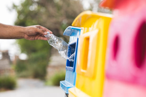 istock A young man drinks from plastic bottles and throws them into the trash. Video about environmental day Separate plastic waste in the correct category. Public trash 1314767476
