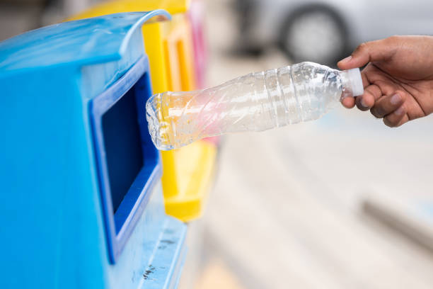 istock A young man drinks from plastic bottles and throws them into the trash. Video about environmental day Separate plastic waste in the correct category. Public trash 1314767493