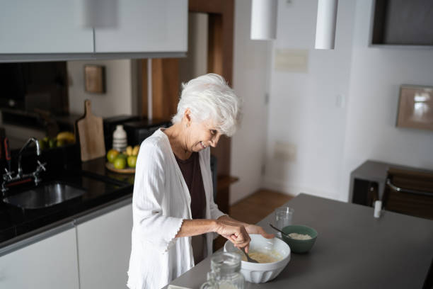 istock Senior woman cooking at home 1314772608