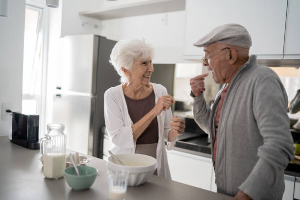 istock Senior couple cooking at home 1314772837