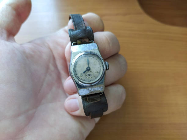 istock Old soviet gold wrist watch in hand close-up 1314773535