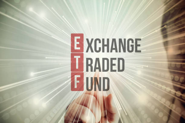 A Man Points to ETF Exchange Traded Fund A man points to ETF Exchange Traded Fund exchange traded fund stock pictures, royalty-free photos & images