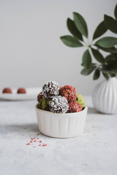 istock energy balls on a light table, bowl. Homemade healthy sweets 1314777313