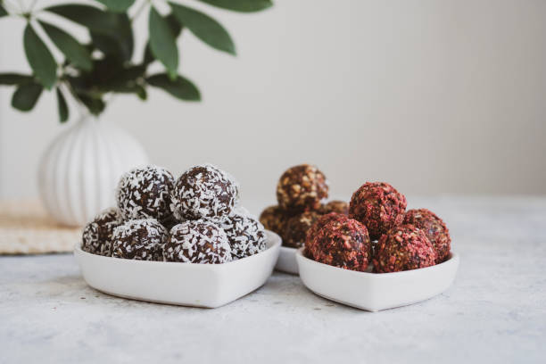 istock energy balls on a light table, bowl. Homemade healthy sweets 1314777316
