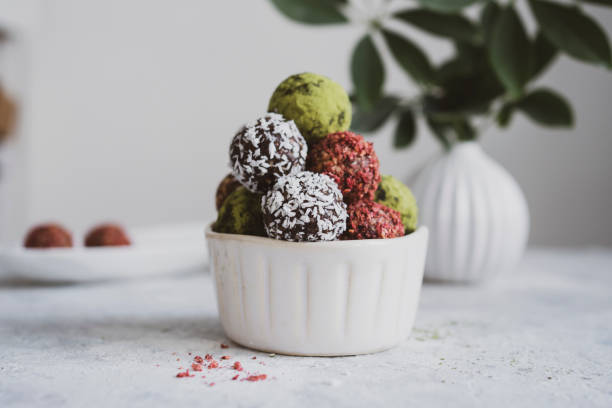 istock energy balls on a light table, bowl. Homemade healthy sweets 1314777318