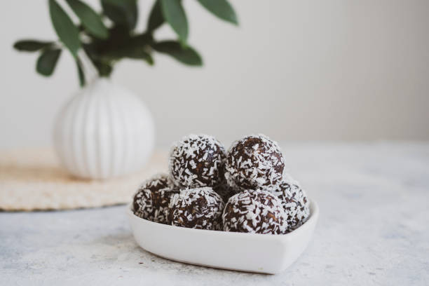 istock energy balls on a light table, bowl. Homemade healthy sweets 1314777330