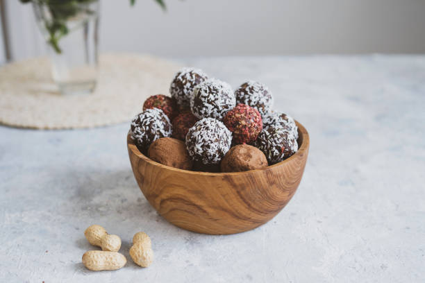 istock energy balls on a light table, bowl. Homemade healthy sweets 1314777857
