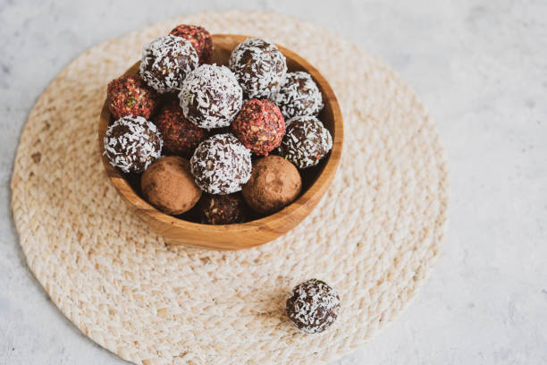 istock energy balls on a light table, bowl. Homemade healthy sweets 1314777862