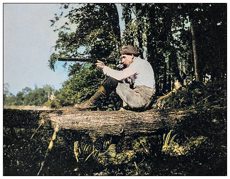 Antique colorized photo: Summer days, aiming, shooting