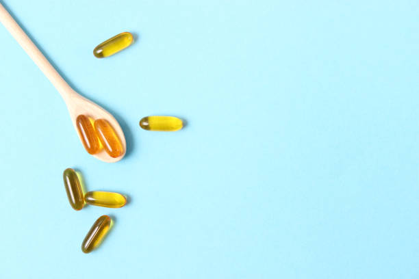 istock Omega-3 capsules on a colored background. Fish oil, healthy supplements 1314778258