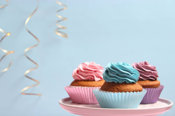istock Delicious cupcake with a candle on a colored background with space for text. 1314778706