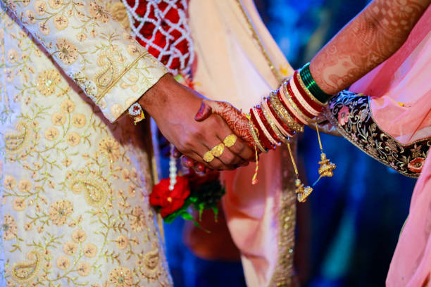 istock Indian couple hand in wedding Satphera ceremony in hinduism 1314779372