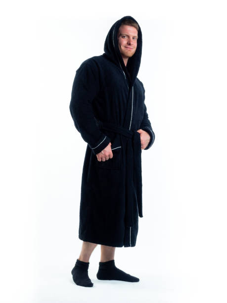 istock strong man in a Bathrobe on an isolated white background with a smile on his face. 1314780136