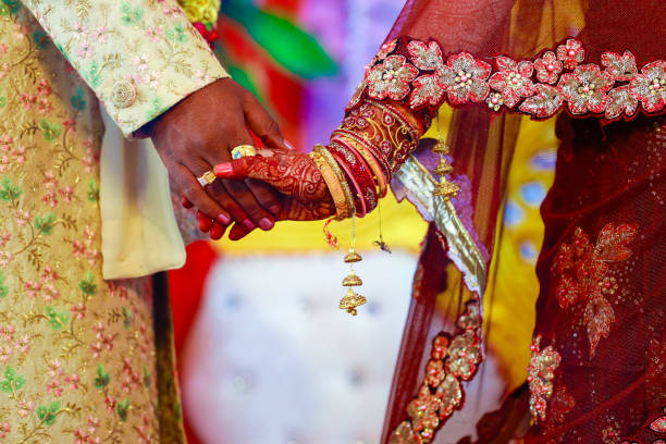 istock Indian couple hand in wedding Satphera ceremony in hinduism 1314780141