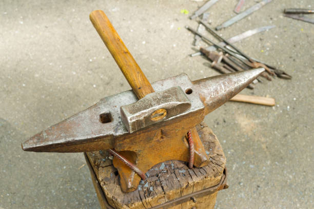 anvil and couple of hammers isolated on white background