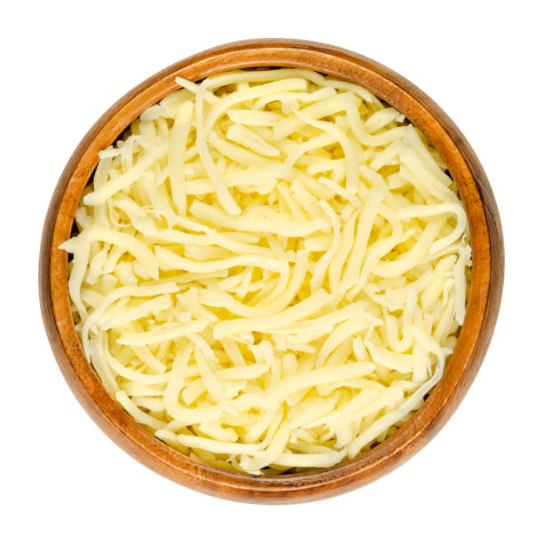 grated pizza cheese, shredded semi-hard cheese, in a wooden bowl - semi skimmed milk imagens e fotografias de stock