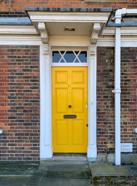 istock Yellow door in London, England 1314780697