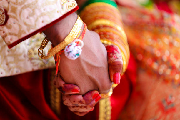 istock Traditional indian wedding ceremony, groom and bride hand 1314781002