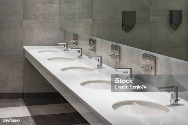White Sinks By The Mirror Stock Photo - Download Image Now - Public Restroom, Sink, Bathroom