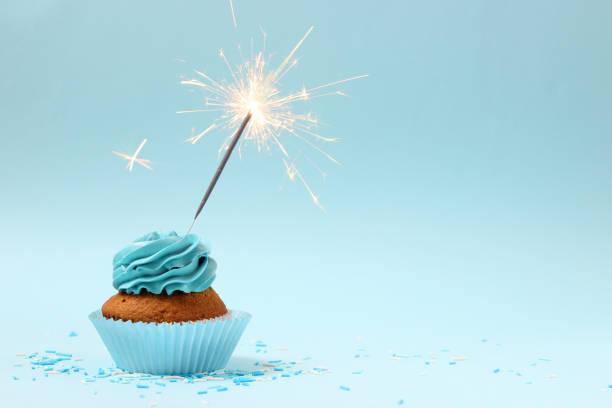 istock Delicious cupcake with a candle on a colored background 1314781072