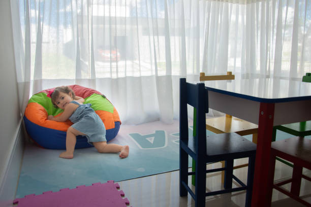 istock baby playing in colorful poof 1314781085