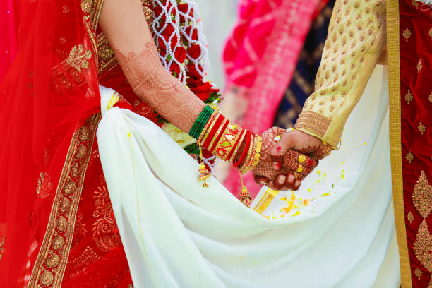 istock Indian couple hand in wedding Satphera ceremony in hinduism 1314782155