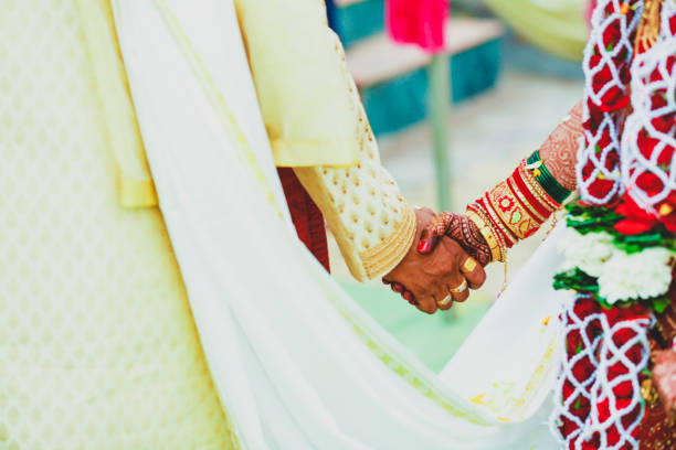 istock Indian couple hand in wedding Satphera ceremony in hinduism 1314782541