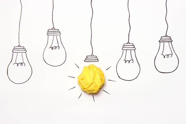 istock creative concept idea. Painted light bulb with a crumpled paper yellow ball. 1314782758