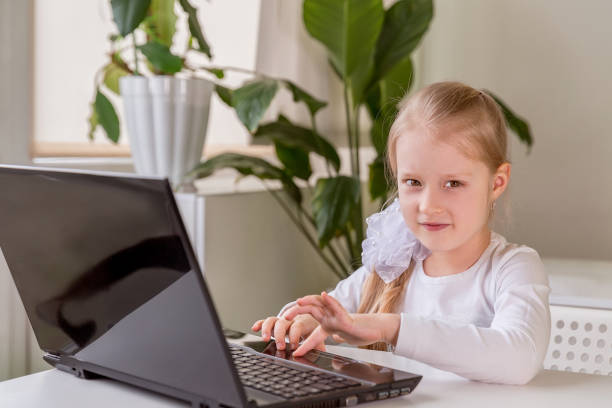 istock The girl learns (communicates, talks) through a computer / laptop 1314782994