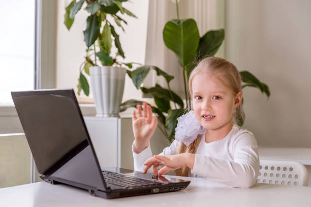 istock The girl learns (communicates, talks) through a computer / laptop 1314783030