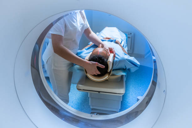 istock View through MRI scanner tunnel on positioning patient head 1314783925