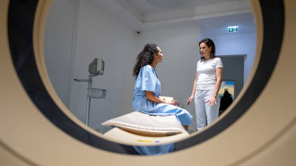 istock Doctor and patient view through MRI machine tunnel. 1314783932