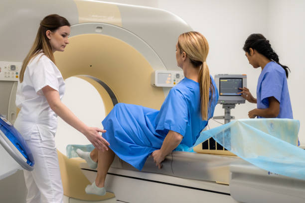 istock Female patient getting up from bed after MRI scanning. 1314783952