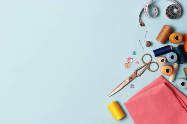 istock Set of different sewing accessories on a colored background close-up 1314783991