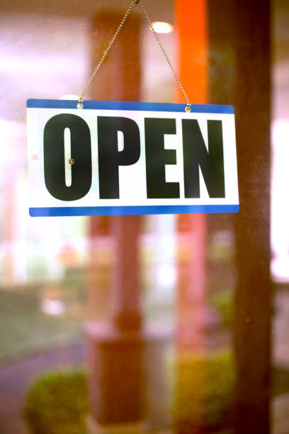 istock Small Business with OPEN sign. 1314784099