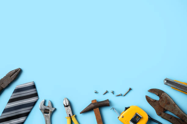 istock Father's Day design concept. Top view of Father's working tools on blue background. 1314785608