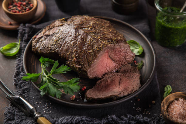 istock delicious roast beef with green parsley sauce 1314786555