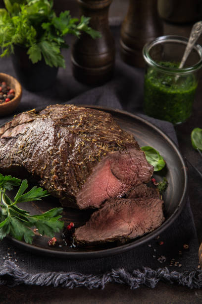 istock delicious roast beef with green parsley sauce 1314786566