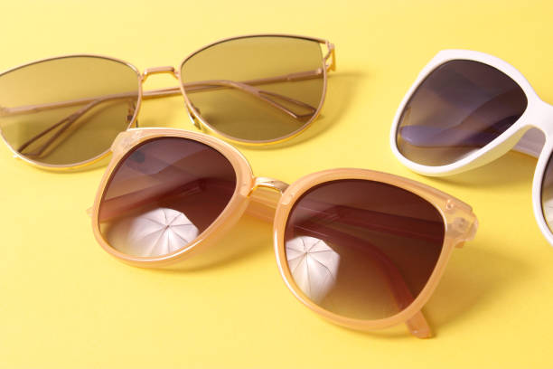 istock set of sunglasses on a colored background top view. 1314786964
