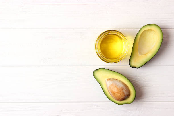 istock Avocado and avocado oil close up on the table 1314787989