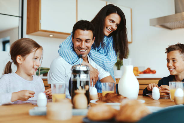 istock Family laughing over breakfast 1314788760