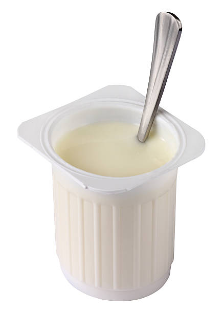 istock Plain white yogurt in a cup with a spoon in the middle 131478982
