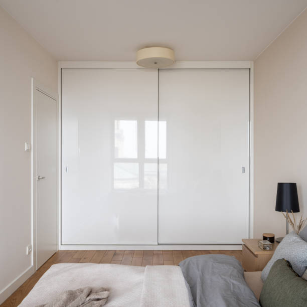istock Big white wardrobe in bedroom 1314793409
