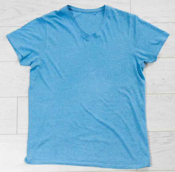 istock Blue t-shirt mock up top view, blue shirt copy space 1314794797