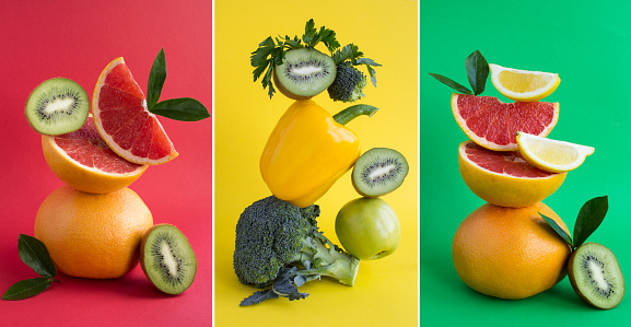 Collage of pyramid of vegetable and  fruit in balance on the colored background. Close-up.