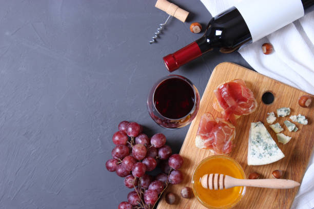 istock red wine and snacks on the table top view. 1314796575