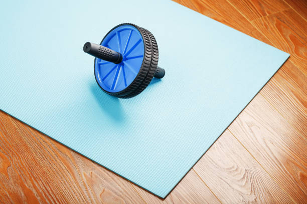 istock Sports roll for training muscles and abs on the blue Mat. 1314798115