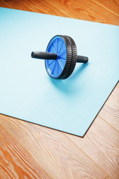 istock Sports roll for training muscles and abs on the blue Mat. 1314798320