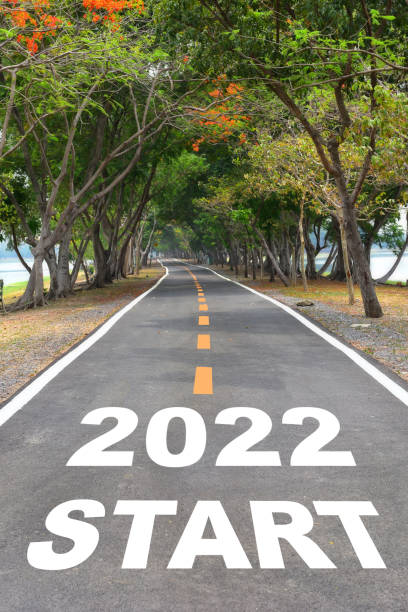 istock Start to new year 2022 on asphalt road surface 1314799011