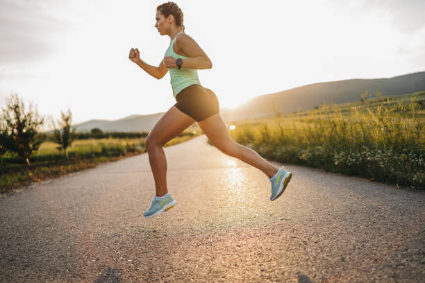 istock Young female athlete jogging outdoors 1314801254